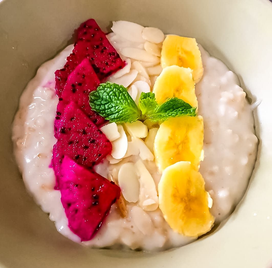 Bowl of dragon fruit, banana and coconut prepared at Alamanda