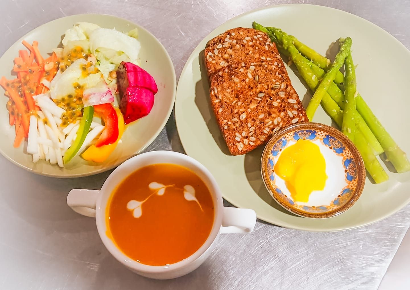 Breakfast of eggs, fresh fruit and juice served in the Alamanda garden