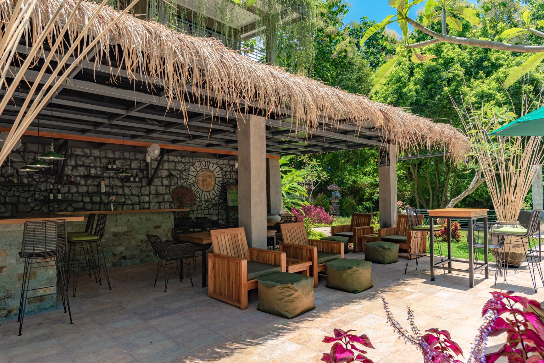 Open-air Balinese pavilion at Alamanda with timber columns and planting