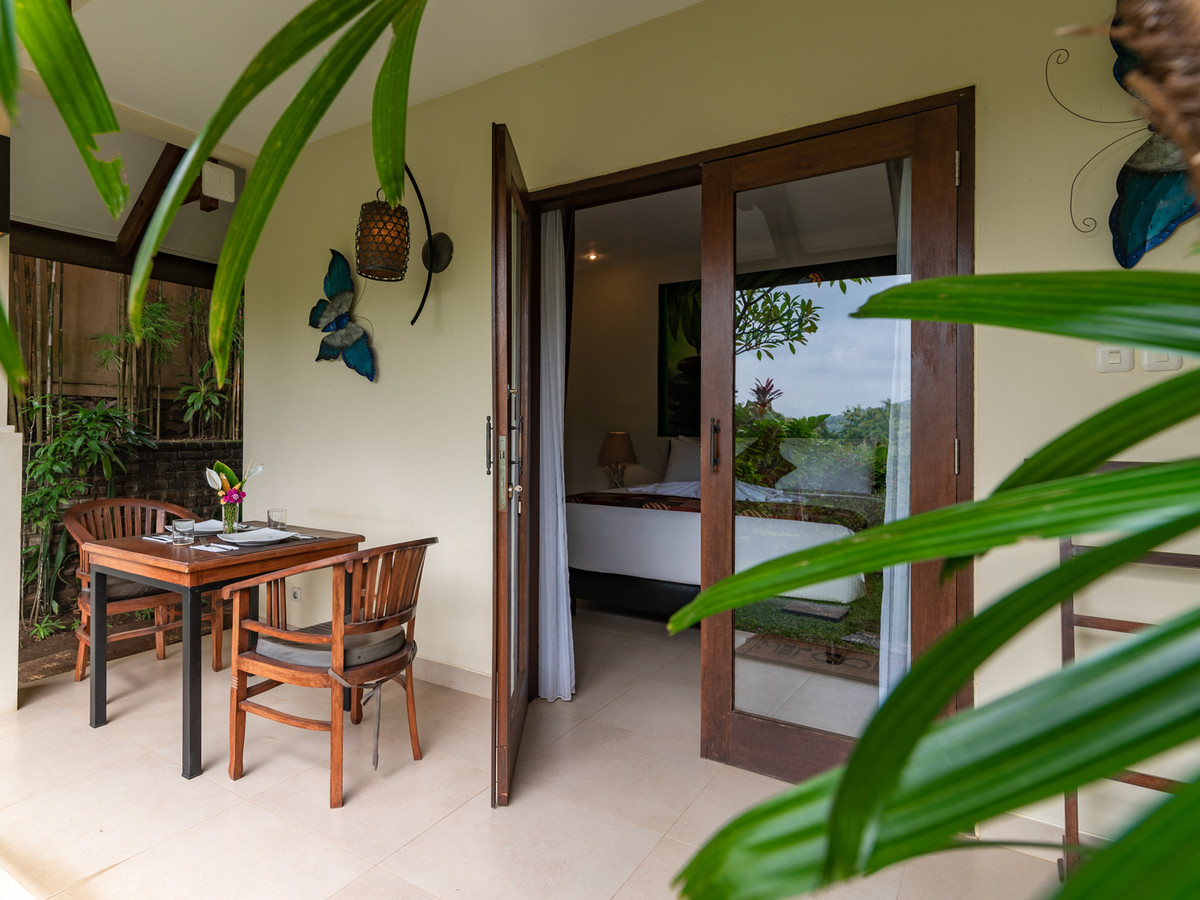 Private terrace of Suite Kupu Kupu at Alamanda, opening onto the garden
